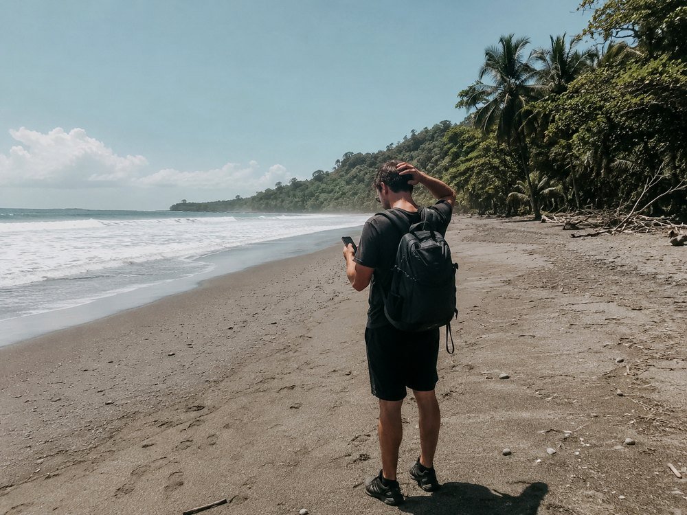 Confused stranded tourist on an empty beach