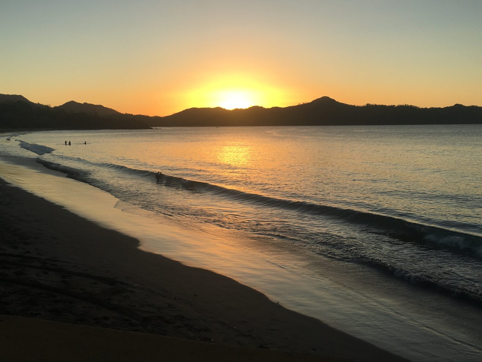 Playa Tamarindo Costa Rica at sunset - the long crescent Pacific beach in Guanacaste