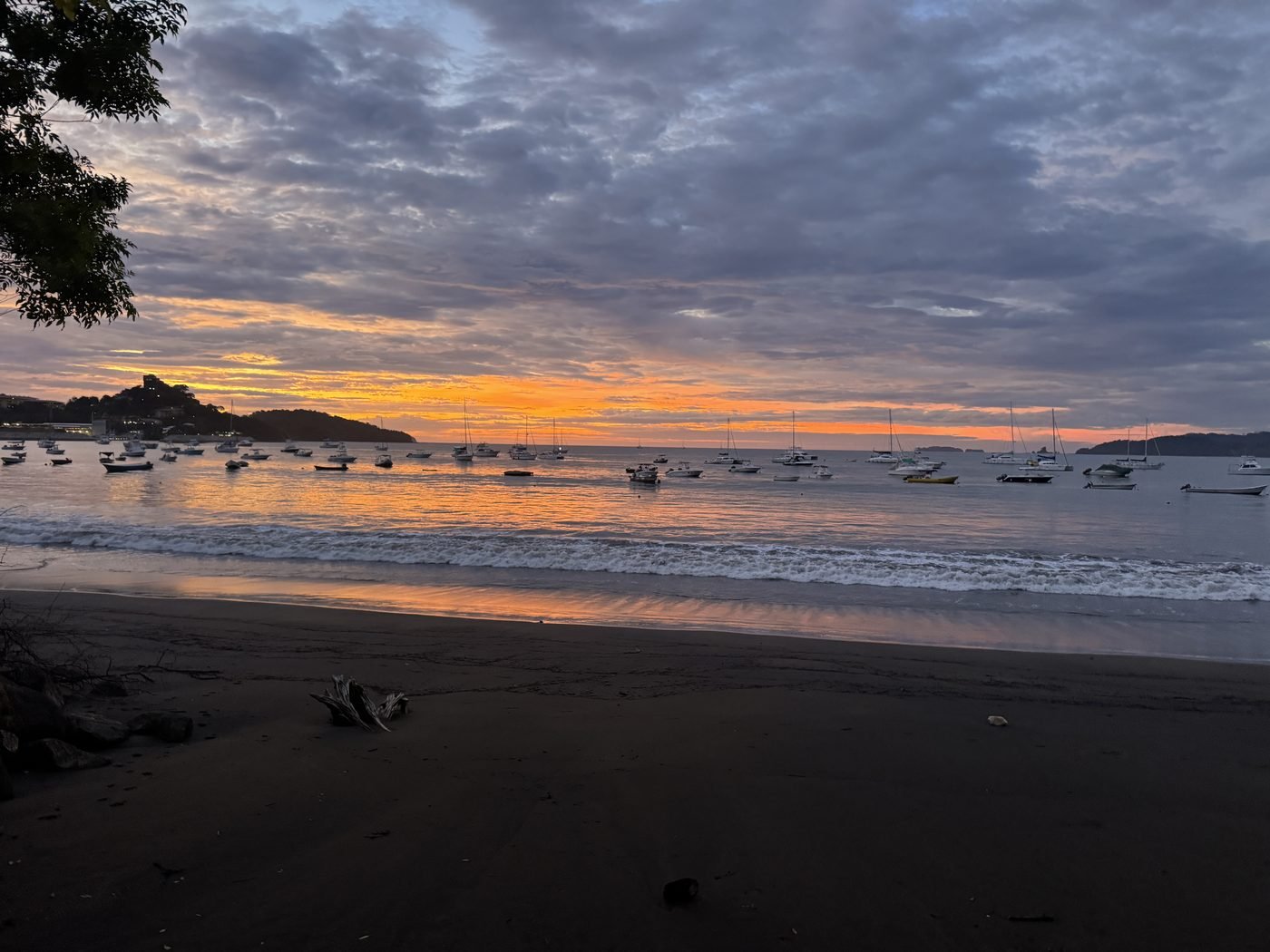 Tour and fishing boats anchored in Potrero Bay at sunset, a common pickup spot for Guanacaste boat tours