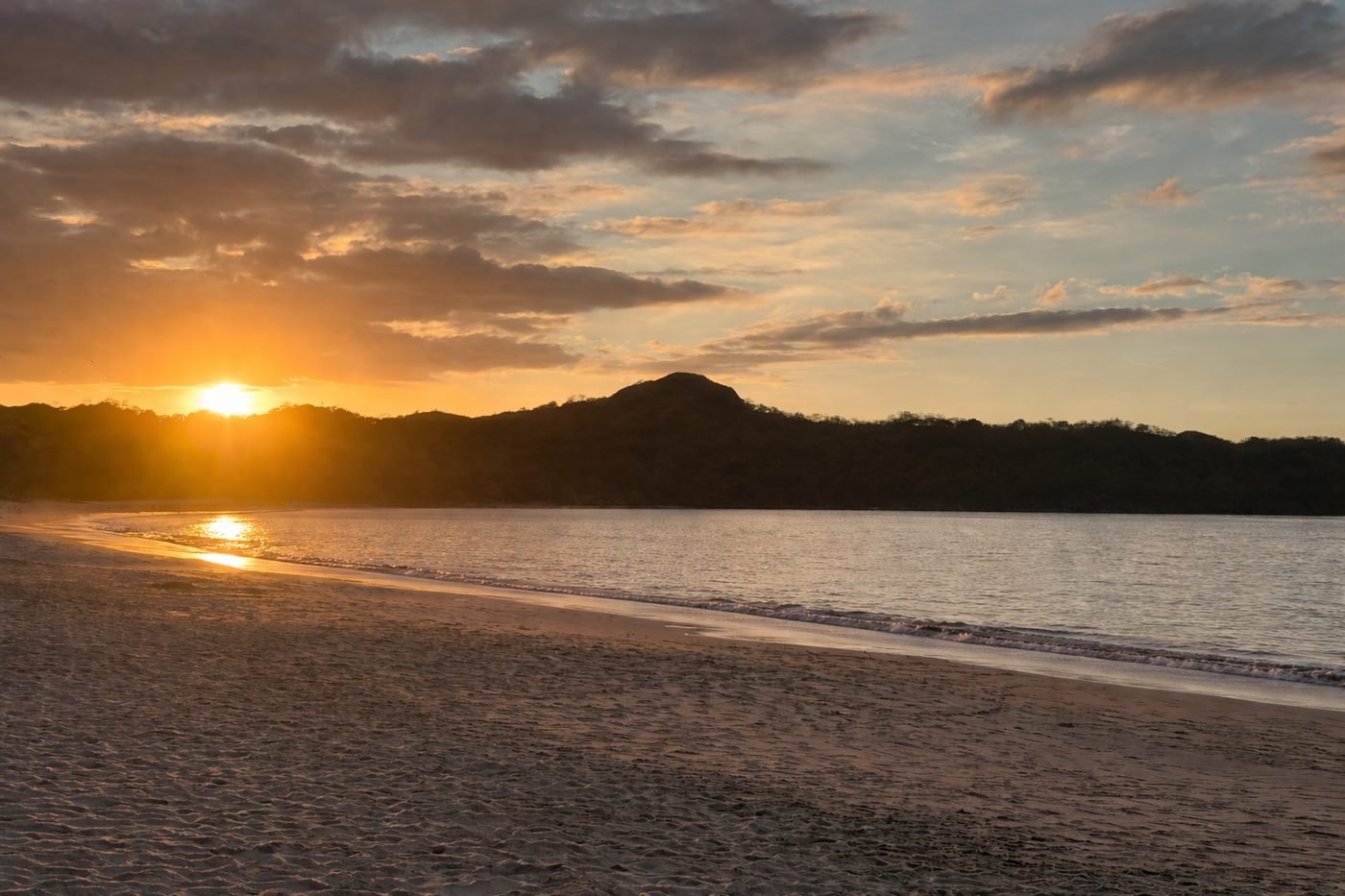 Empty Guanacaste beach at golden hour on the quiet side of Costa Rica's Gold Coast
